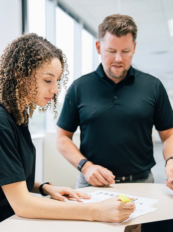 woman and man looking at forms for renting a vehicle in Jacksonville